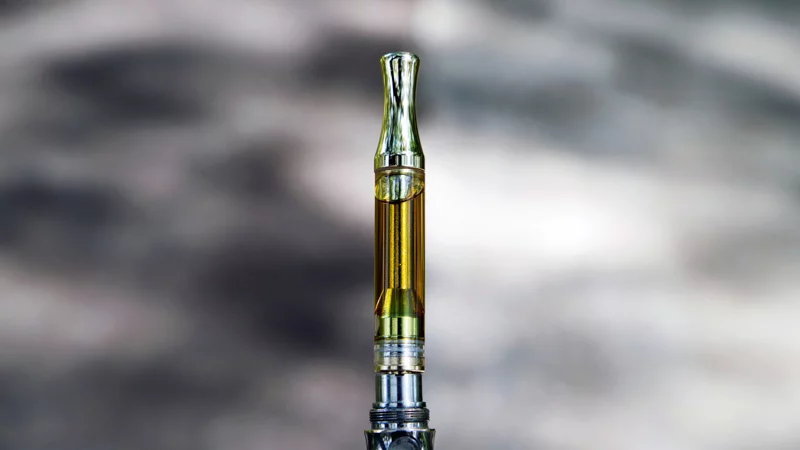 THC Oil with Vape Pen in White Background