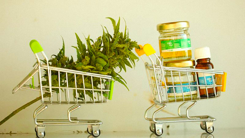 Hemp oil and buds in a shopping cart