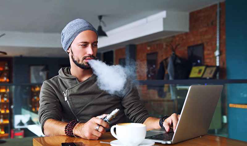 Guy smoking weed while working